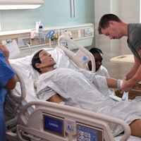 Clinicians in a simulation training session
