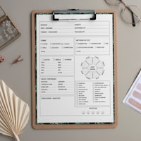 Clipboard with forms on a desk